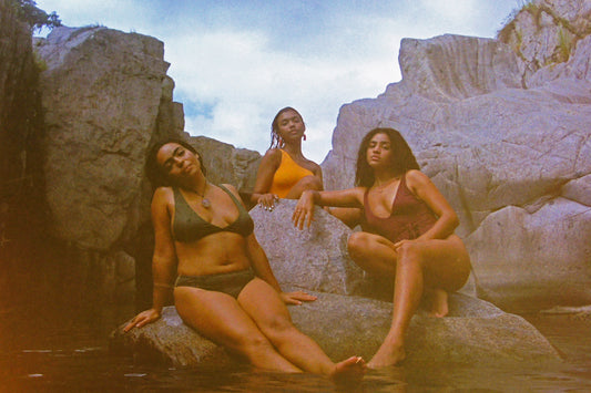 BIPOCs & Trans Folks Take Sexual Health Into Their Own Hands - Black Model Touching Her Hair in the Sun