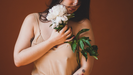 How to Deal During the Fourth Trimester - Model Holding White Flowers
