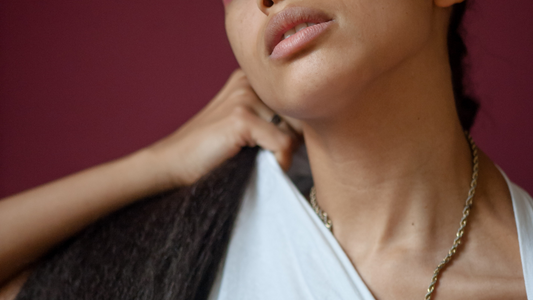 How Stress Affects Your Sexual Health - Closeup pf Model in White T-Shirt on Purple Background