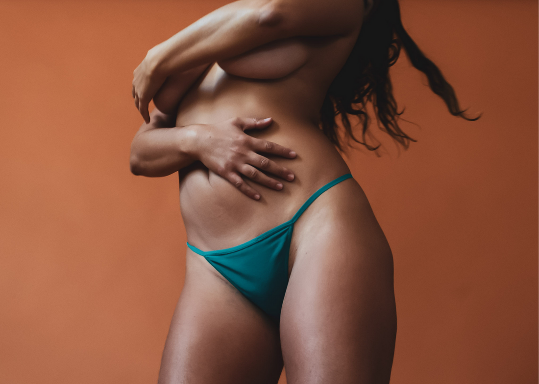 Dancing Through the Pain of Vaginismus - Topless Model in Green Panties Hugging Herself