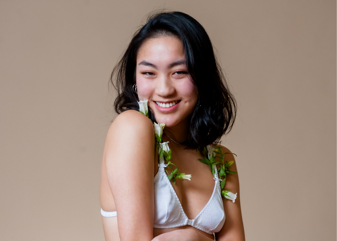 Sexify Your Self Care Routine - Model Smiling in White Bra