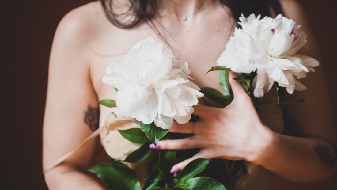 Vagina is Not A Dirty Word - Torso of Model Holding White Flowers