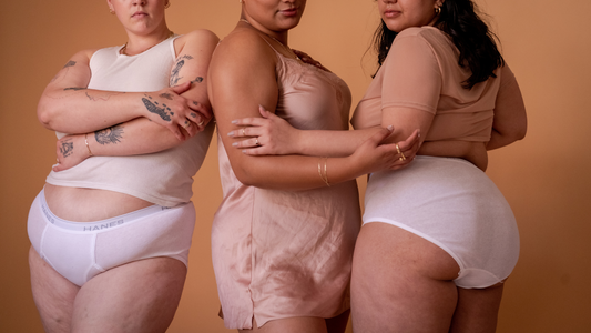 STI 101 - The Models Standing and Crossing their Arms Wearing Nude Clothing