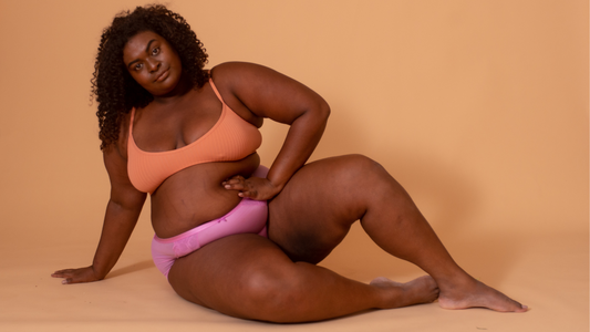 The Dark, Twisted, and Strange History of Gynecology - Gabby posing in an Orange Bra and Pine Underwear