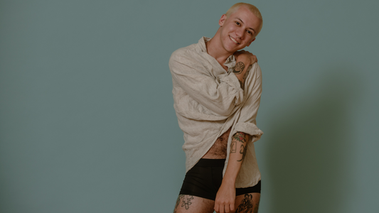 My Hysterectomy: Saving My Body and My Mind - Clark posing in a white button down shirt and black boxers