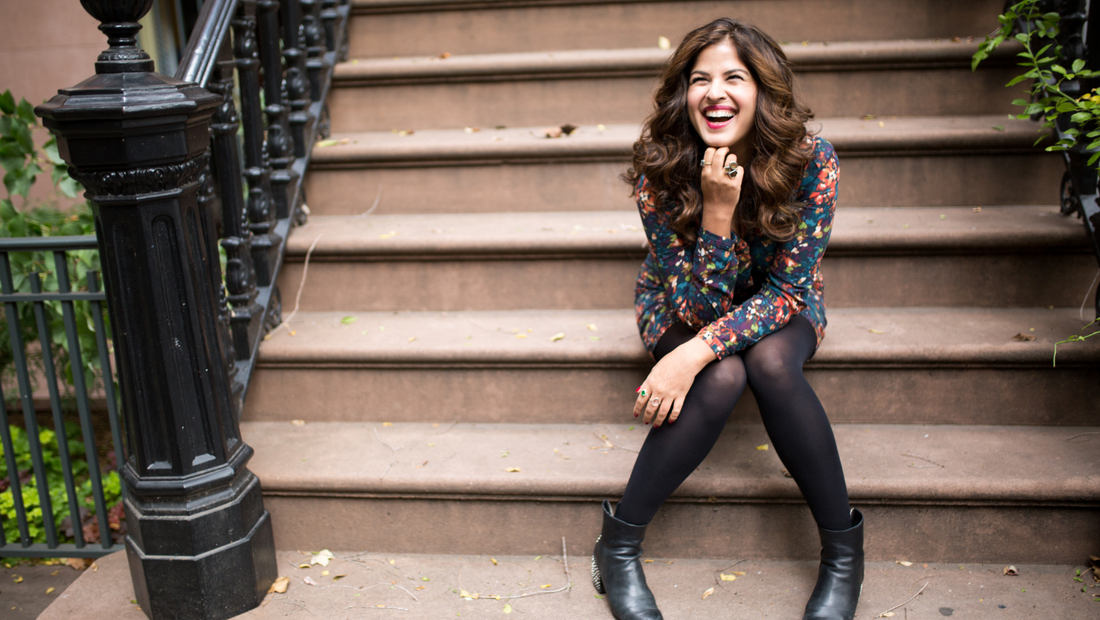 Chronicon Blog - Nitika  Chopra sitting on steps and laughing