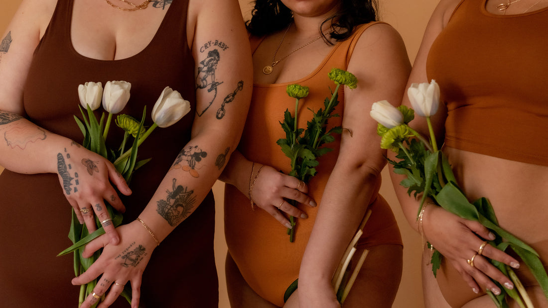 Coochie Survival Guide - Torsos of Models in Nude Body Suits Holding Flowers