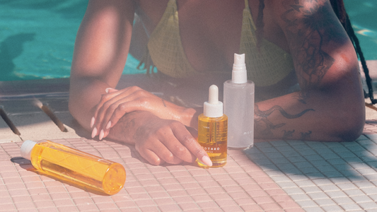 Woman at pool with Momotaro's Holy Hydration Bundle