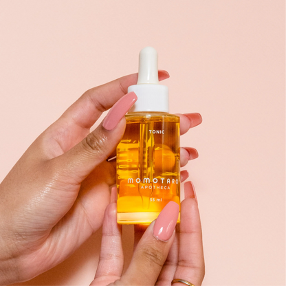 Tonic bottle in hand.