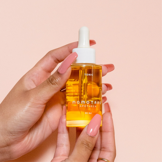 Tonic bottle in hand.