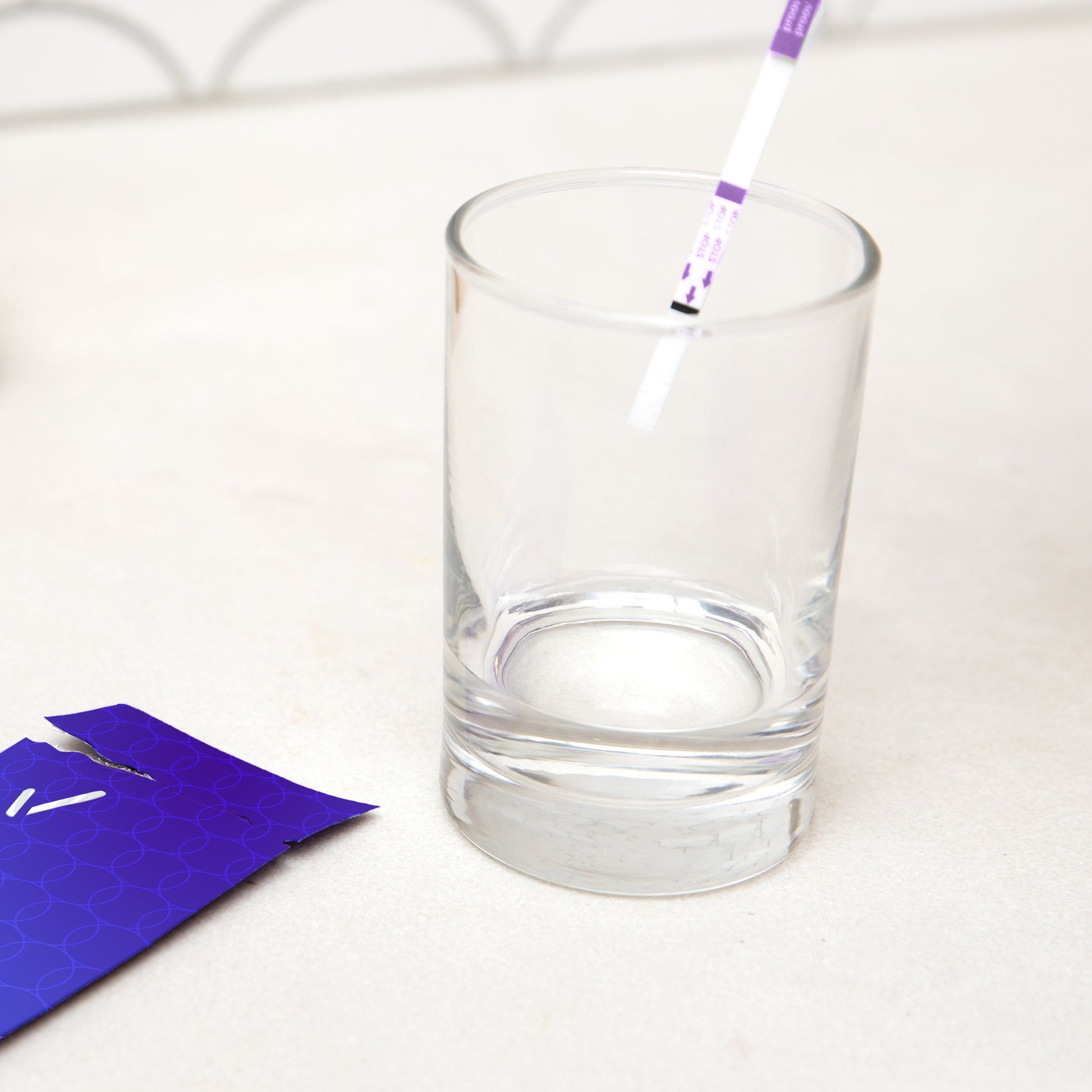 Proov Fertility Test and glass with liquid