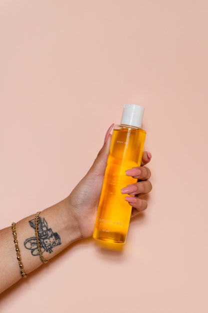 momotaro body oil held in hand